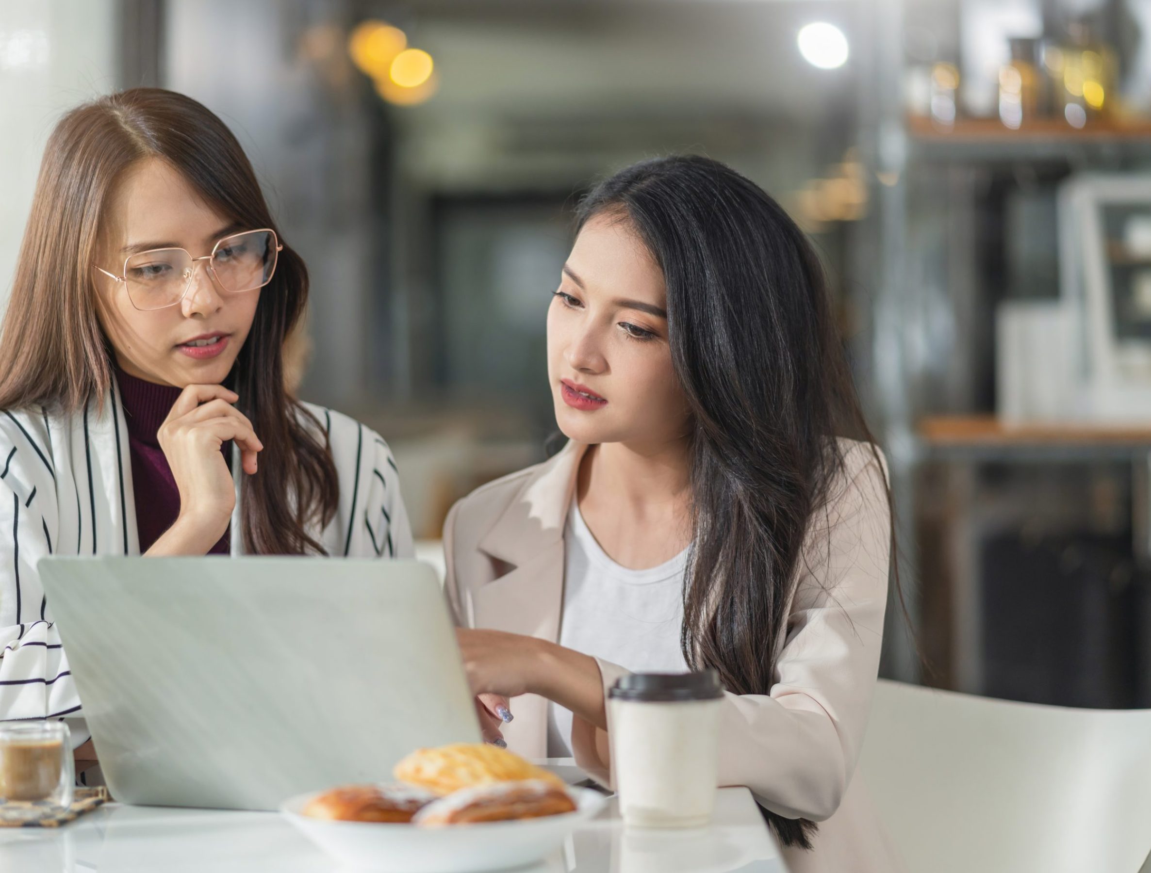 asian female creative agency casual meeting discussion working with laptop coffee work from home with client co worker,asian young woman with window and water rain drop raining background