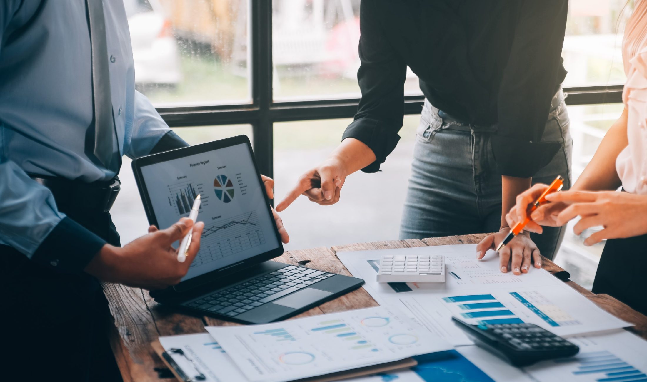 Fund managers team consultation and discuss about analysis Investment stock market at office